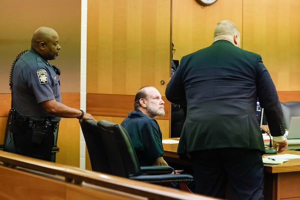 Jay Berger looks at his attorney, Stuart Mones, after a Fulton County judge granted him bond during a preliminary hearing.