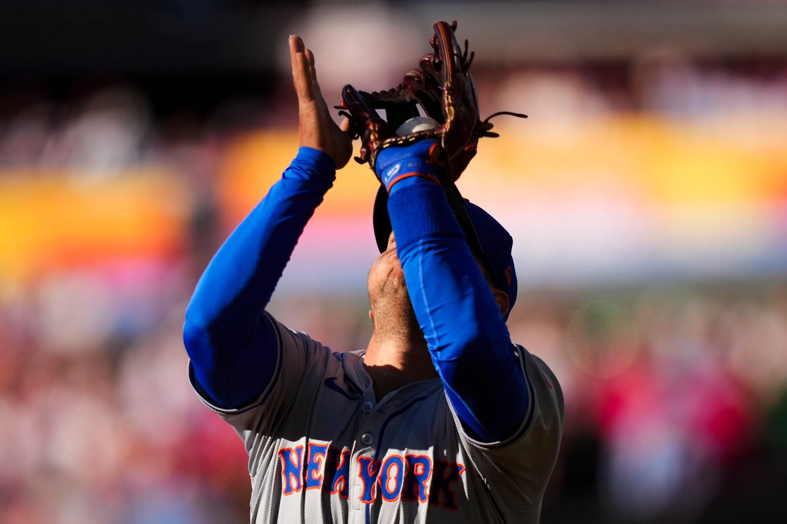 New York Mets second baseman Jose Iglesias catches a fly out by Philadelphia Phillies' Alec Bohm during the first inning of Game 1 of a baseball NL Division Series, Saturday, Oct. 5, 2024, in Philadelphia. (AP Photo/Matt Slocum)