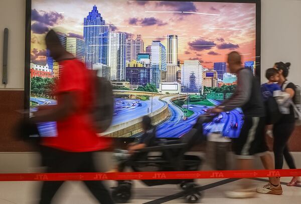 Passengers walk through Hartsfield-Jackson International Airport on Friday, May 24, 2024. Hartsfield-Jackson had a record number of passengers at security checkpoints as Memorial Day travel ramps up. (John Spink/AJC)