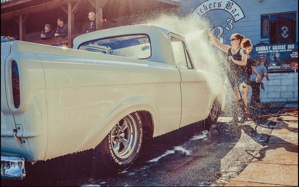 Some of the Clermont Lounge's exotic dancers washed cars Feb. 26, 2017, at B3 Bar and Grill in Austell for extra cash because they've been without pay for weeks. The renovation of the iconic Atlanta dive bar has taken longer than expected.