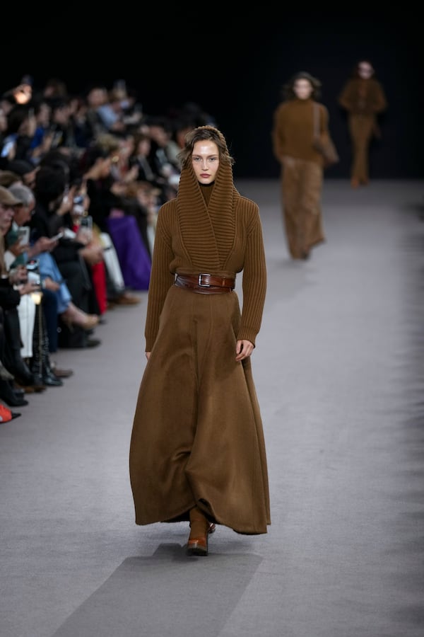 A model wears a creation as part of the Max Mara Fall/Winter 2025-2026 Womenswear collection presented in Milan, Italy, Thursday, Feb. 27, 2025. (AP Photo/Antonio Calanni)