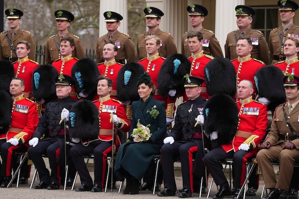 Britain's Kate, the Princess of Wales, poses for a photo with members of the Irish Guards at a special St Patrick's Day parade and celebration at Wellington Barracks in London, Monday, March 17, 2025.(AP Photo/Kirsty Wigglesworth)