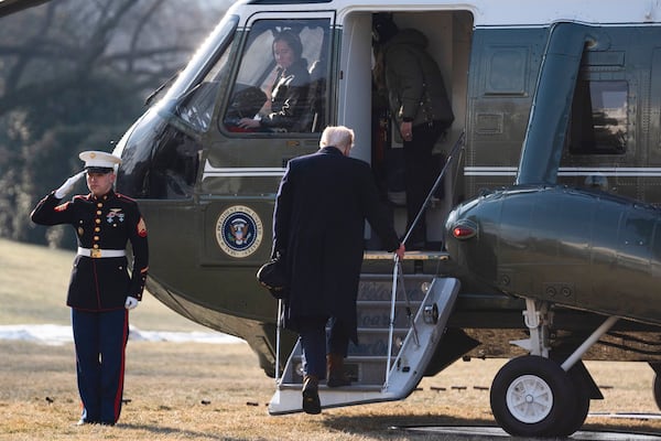 First lady Melania Trump and President Donald Trump board Marine One on the South Lawn of the White House, Friday, Jan. 24, 2025, in Washington. (AP Photo/Evan Vucci)