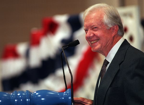 Former President Jimmy Carter listens to a question during his 1999 town hall meeting with students and faculty at Emory University. (BEN GRAY/STAFF)