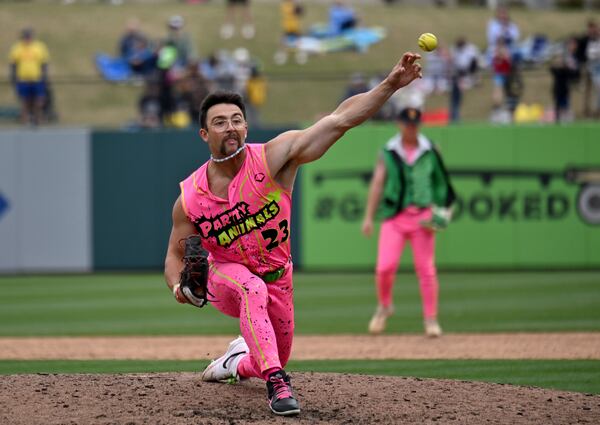 Party Animals' Garrett Declue (23) throws a pitch during first of three-game series at Coolray Field, Saturday, March 23, 2024, in Lawrenceville. The Savannah Bananas’ visit is their first to the Atlanta area since their founding in 2016. The team is based in their namesake Georgia city and plays 30-plus games a year at Historic Grayson Stadium, a century-old ballpark on Savannah’s eastside. (Hyosub Shin / Hyosub.Shin@ajc.com)