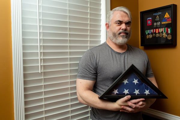 Bruce Barber, a retired Gulf War veteran, in his home in Kennesaw. Congress passed the Veterans Association MISSION Act in June 2019, aiming to give veterans greater access to health care in VA facilities and the community. In Georgia, however, there are warning signs that it’s failing to live up to its promise. It took Barber 52 days to get a consultation on his war-injured neck because of what he described as VA fumbles, red tape, delays and runarounds. Other veterans told similar stories. (Photo/Rebecca Wright for the AJC)