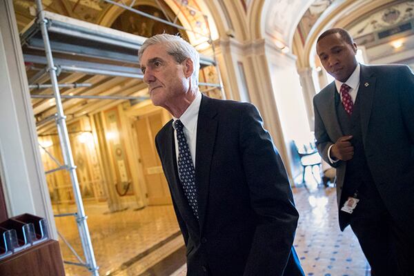 In this June 21, 2017 file photo, special counsel Robert Mueller departs after a closed-door meeting with members of the Senate Judiciary Committee about Russian meddling in the election and possible connection to the Trump campaign, on Capitol Hill in Washington. In populist tones, President Donald Trump is trying to turn the investigation into his campaign's ties to Russia into a rallying cry, labeling it as an existential threat to the loyal base that fueled his surprise 2016 election triumph.