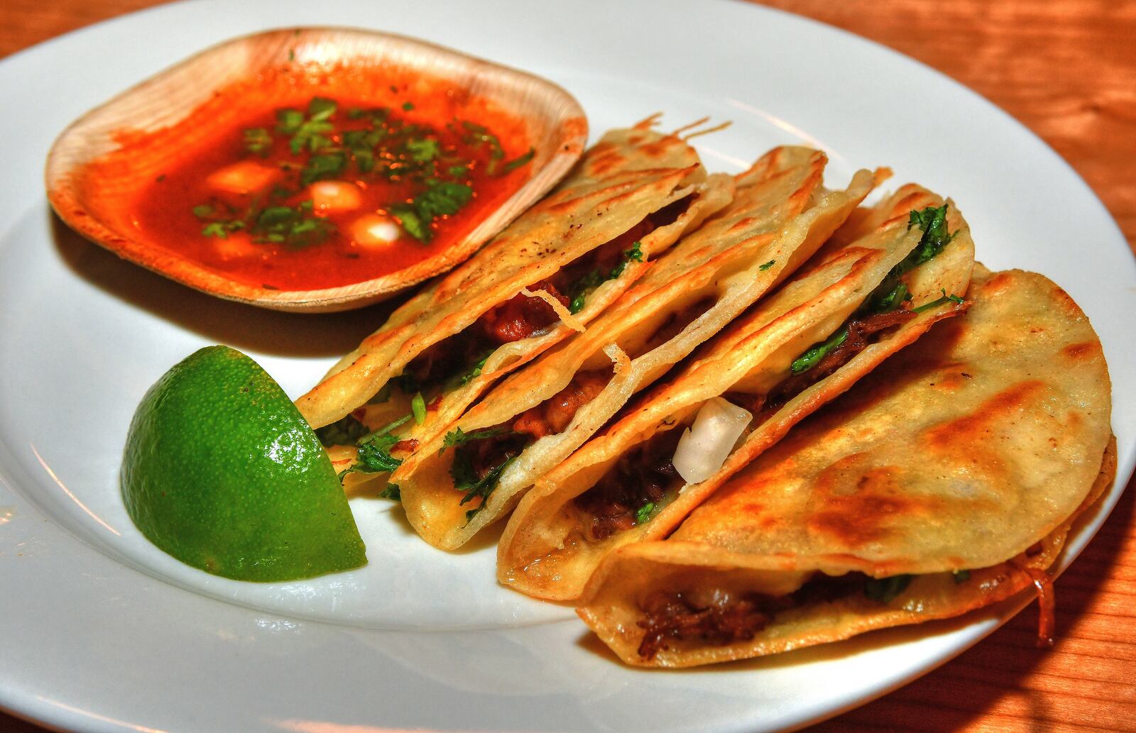 Oxtail Birria Tacos from Pretty Little Tacos at the new Politan Row at Colony Square. Pretty Little Tacos started at a food truck park. (Chris Hunt for The Atlanta Journal-Constitution)