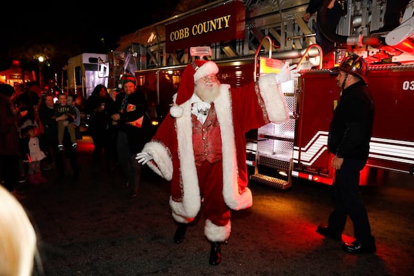 Santa arriving at the Vinings Jubilee tree lighting ceremony is always a hit with youngsters. 
Courtesy of CatMax Photography.