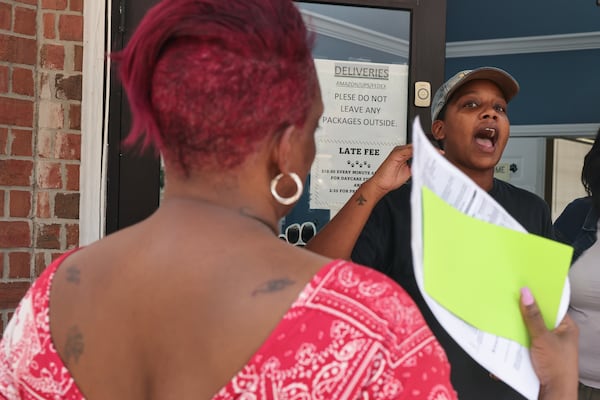 Diamond Jones, office manager at Northwest Youth Center at Magnolia Park Apartments gives direction to residents awaiting utility assistance on Wednesday July 26, 2023. The Fulton Atlanta Community Action is providing residents with assistance through the Low Income Home Energy Assistance Program to cover higher utility bills. (Natrice Miller/natrice.miller@ajc.com)