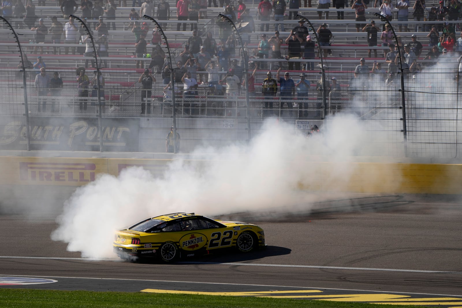 NASCAR Cup Series driver Joey Logano (22) does a burnout after winning a NASCAR Cup Series auto race Sunday, Oct. 20, 2024, in Las Vegas. (AP Photo/John Locher)