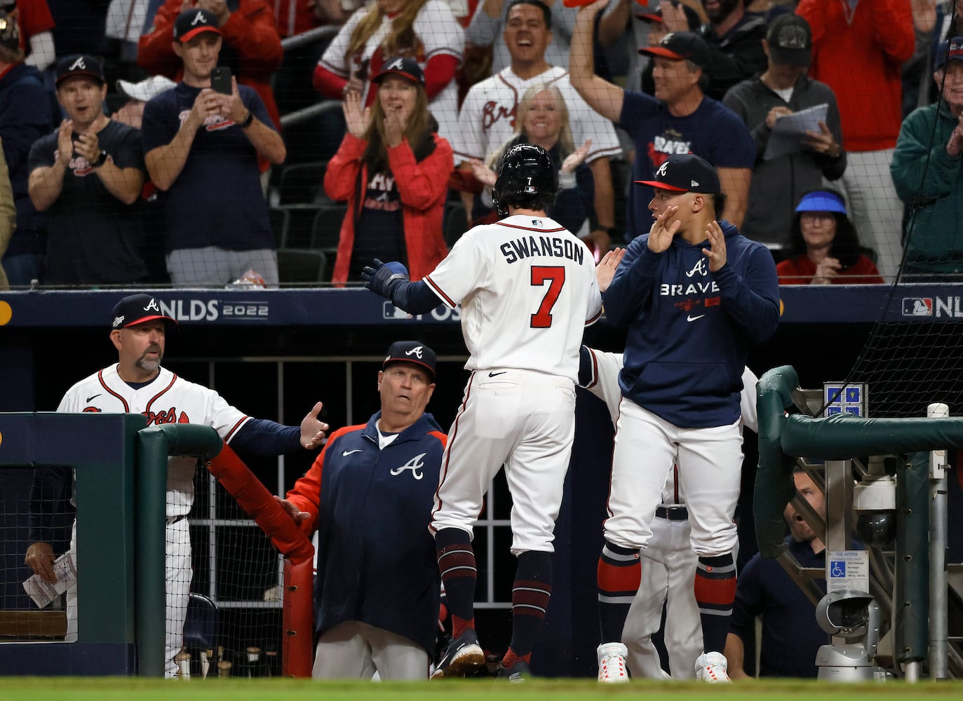 Atlanta Braves shortstop Dansby Swanson (7) celebrates after scoring against the Philadelphia Phillies on an RBI single by Austin Riley during the sixth inning of game two of the National League Division Series at Truist Park in Atlanta on Wednesday, October 12, 2022. (Jason Getz / Jason.Getz@ajc.com)