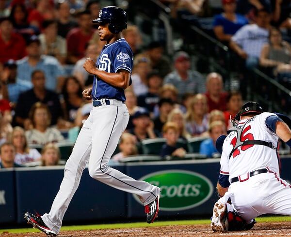 Fan favorite Melvin Upton Jr. scores to tie the game. Ouch. (John Bazemore/AP photo) San Diego Padres pinch runner Melvin Upton Jr., scores past Atlanta Braves catcher A.J. Pierzynski (15) to score the tying run in the 9th inning of baseball game Monday, June 8, 2015, in Atlanta. San Diego won 5-3 in 11 innings. (AP Photo/John Bazemore)