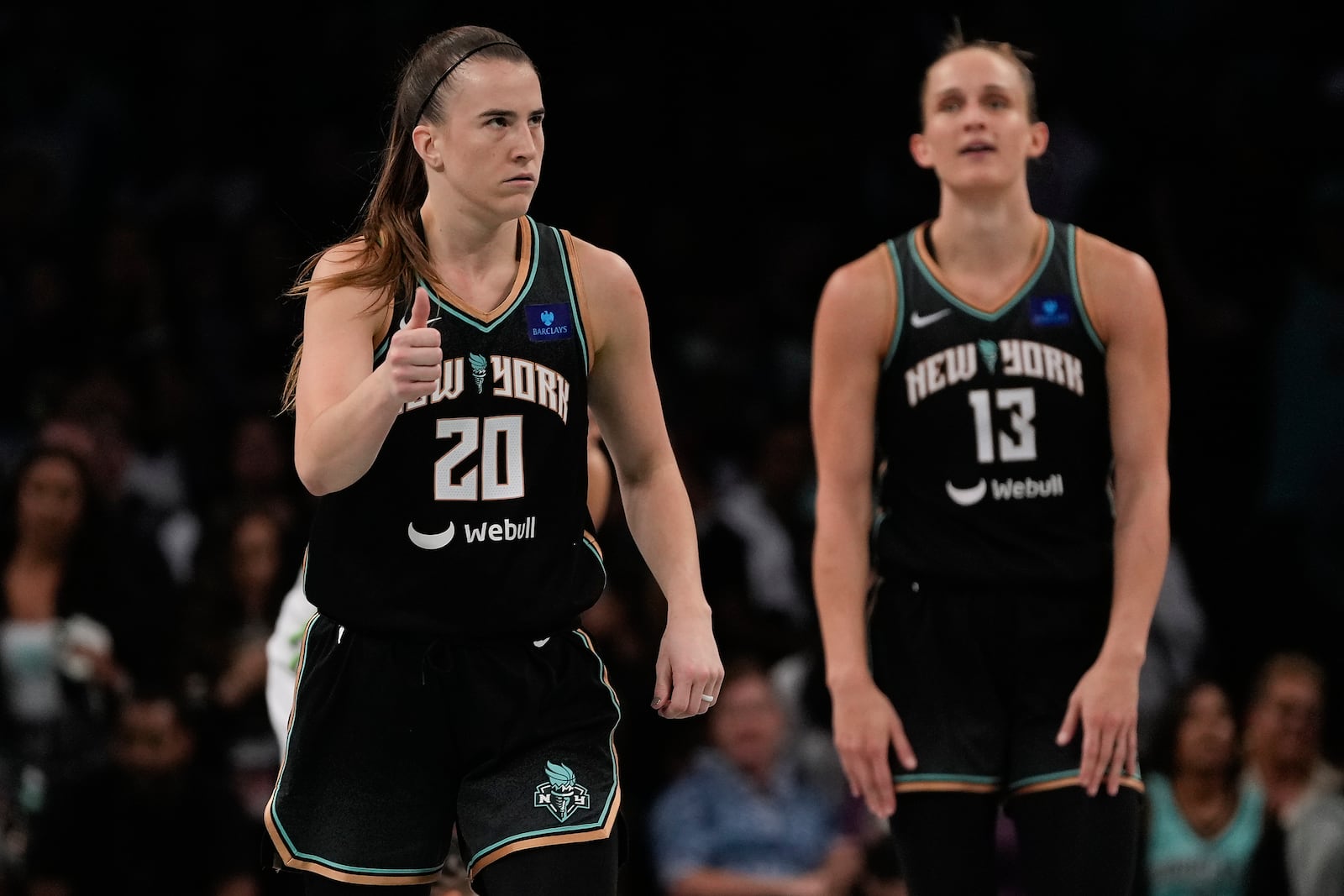 New York Liberty guard Sabrina Ionescu (20) reacts in overtime of Game 5 of the WNBA basketball final series against the Minnesota Lynx, Sunday, Oct. 20, 2024, in New York. (AP Photo/Pamela Smith)