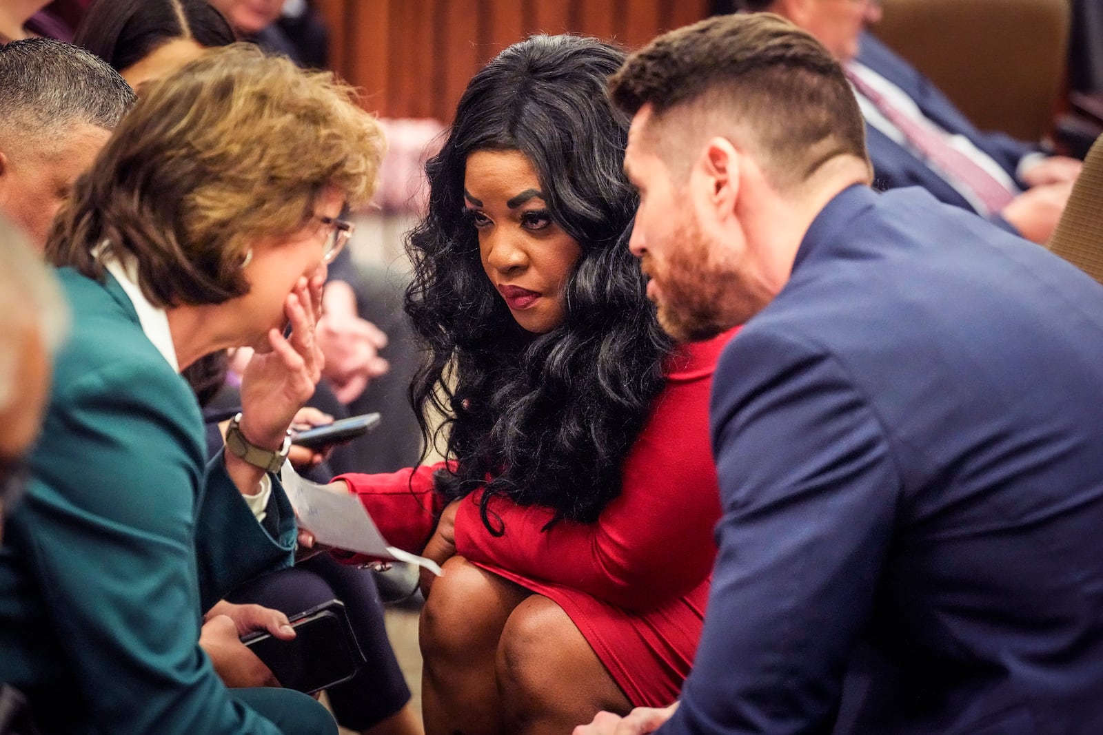 District Attorney Kim Ogg, left, talks to prosecutors Tanisha Manning, center, and Keaton Forcht after a 60-year prison sentence was handed down to former Houston police officer Gerald Gaines on a pair of felony murder convictions they litigated on Tuesday, Oct. 8, 2024, in Houston. Goines was found guilty of felony murder in the 2019 deaths of Dennis Tuttle and Rhogena Nicholas. (Brett Coomer/Houston Chronicle via AP)