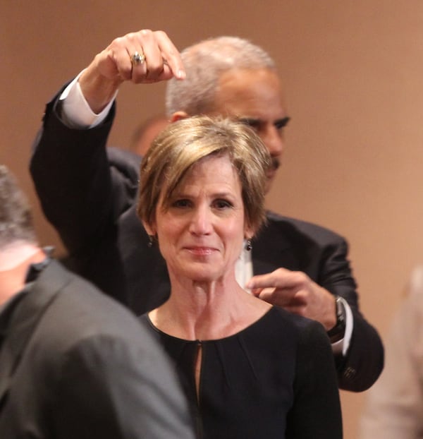 Holder and Yates together before the panel discussion, just before Holder went up to join teh panel and Yates joined the audience. Holder was poing out who he thought was the more important person. (Henry Taylor / henry.taylor@ajc.com)