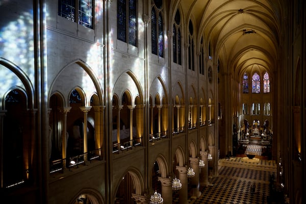 The nave of Notre-Dame de Paris cathedral is seen while French President Emmanuel Macron visits the restored interiors of the monument, Friday, Nov. 29, 2024 in Paris. (Sarah Meyssonnier/Pool via AP)