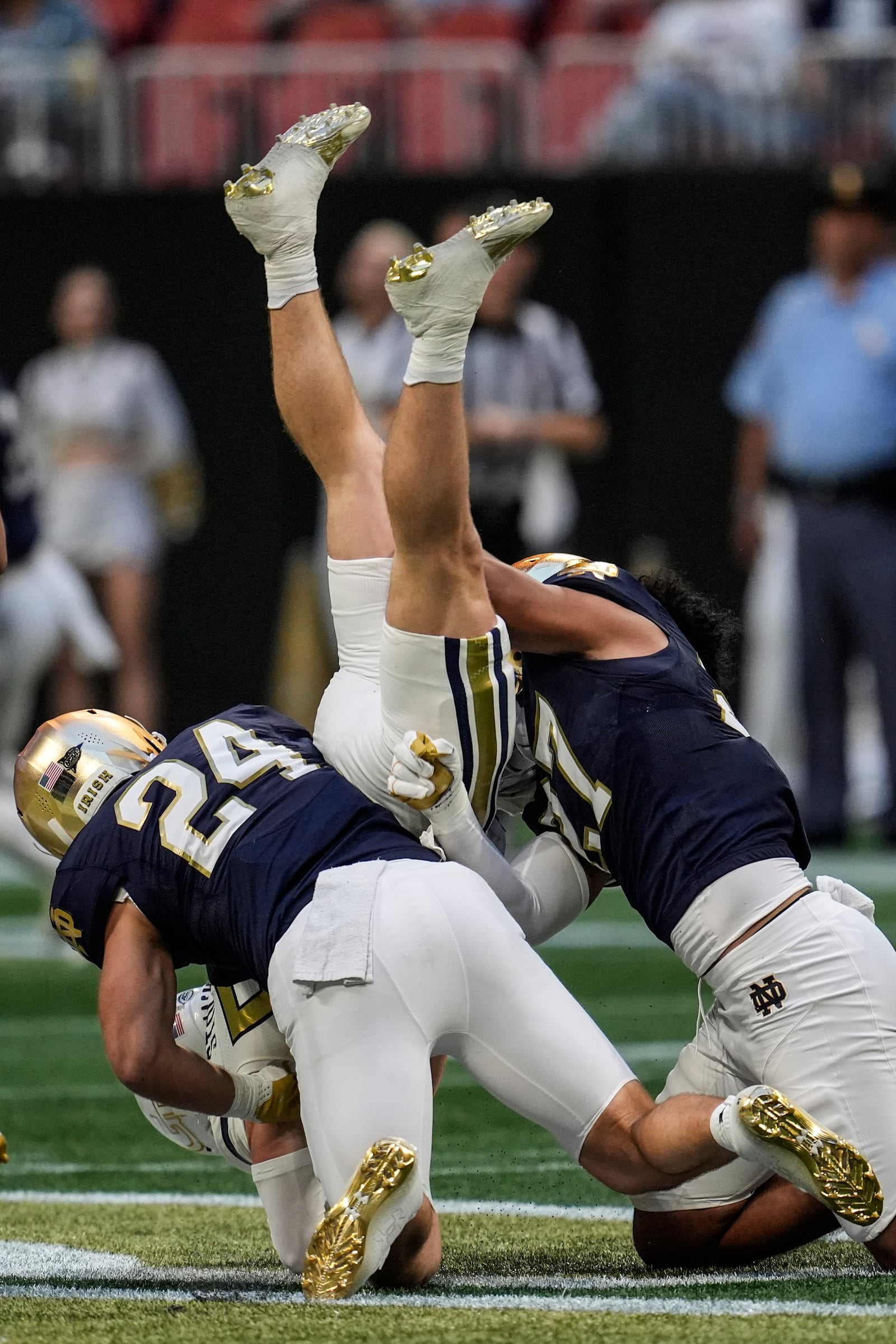 Georgia Tech wide receiver Bailey Stockton (87) is hit by Notre Dame linebacker Jack Kiser (24) during the first half of an NCAA college football game, Saturday, Oct. 19, 2024, in Atlanta. (AP Photo/Mike Stewart)