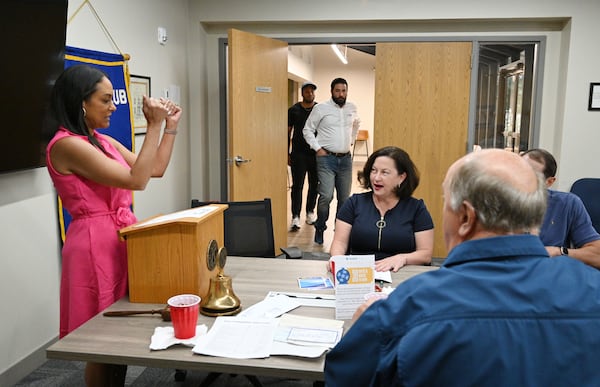 Former Republican state Sen. JaNice VanNess (center) is running to oust County Commission Chair Oz Nesbitt in the June 18 Democratic primary after recently switching parties. Democratic leaders are worried she could switch back to the GOP if she wins. While she says she won't vote for Republican Donald Trump in this year's presidential election, she also has not endorsed Democratic President Joe Biden's bid for reelection. (Hyosub Shin / AJC)