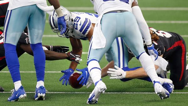 Dallas Cowboys cornerback C.J. Goodwin (29) secures the ball on an onside kick attempt as Atlanta Falcons wide receiver Olamide Zaccheaus (17) attempts to take it in the closing minutes on Sunday, Sept. 20, 2020, at AT&T Stadium in Arlington, Texas. (Vernon Bryant/The Dallas Morning News)