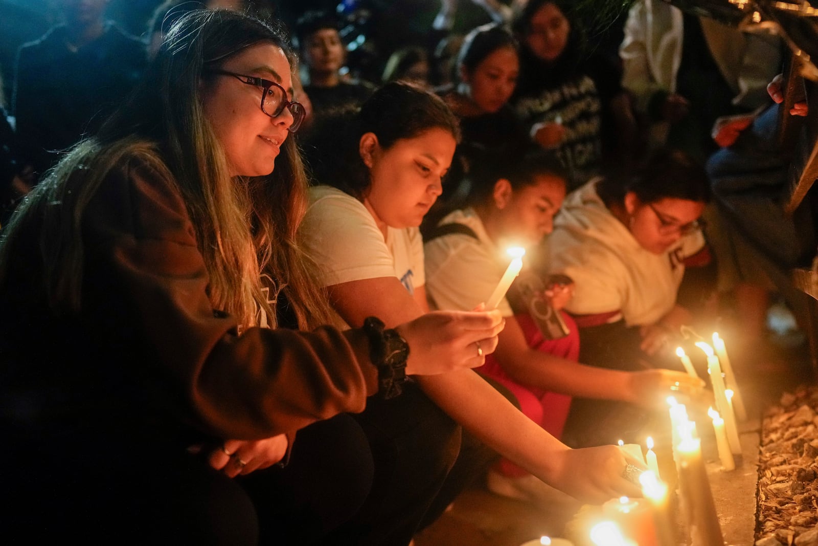 Fans light candles outside the hotel where former One Direction singer Liam Payne was found dead after he fell from a balcony in Buenos Aires, Argentina, Wednesday, Oct. 16, 2024. (AP Photo/Natacha Pisarenko)