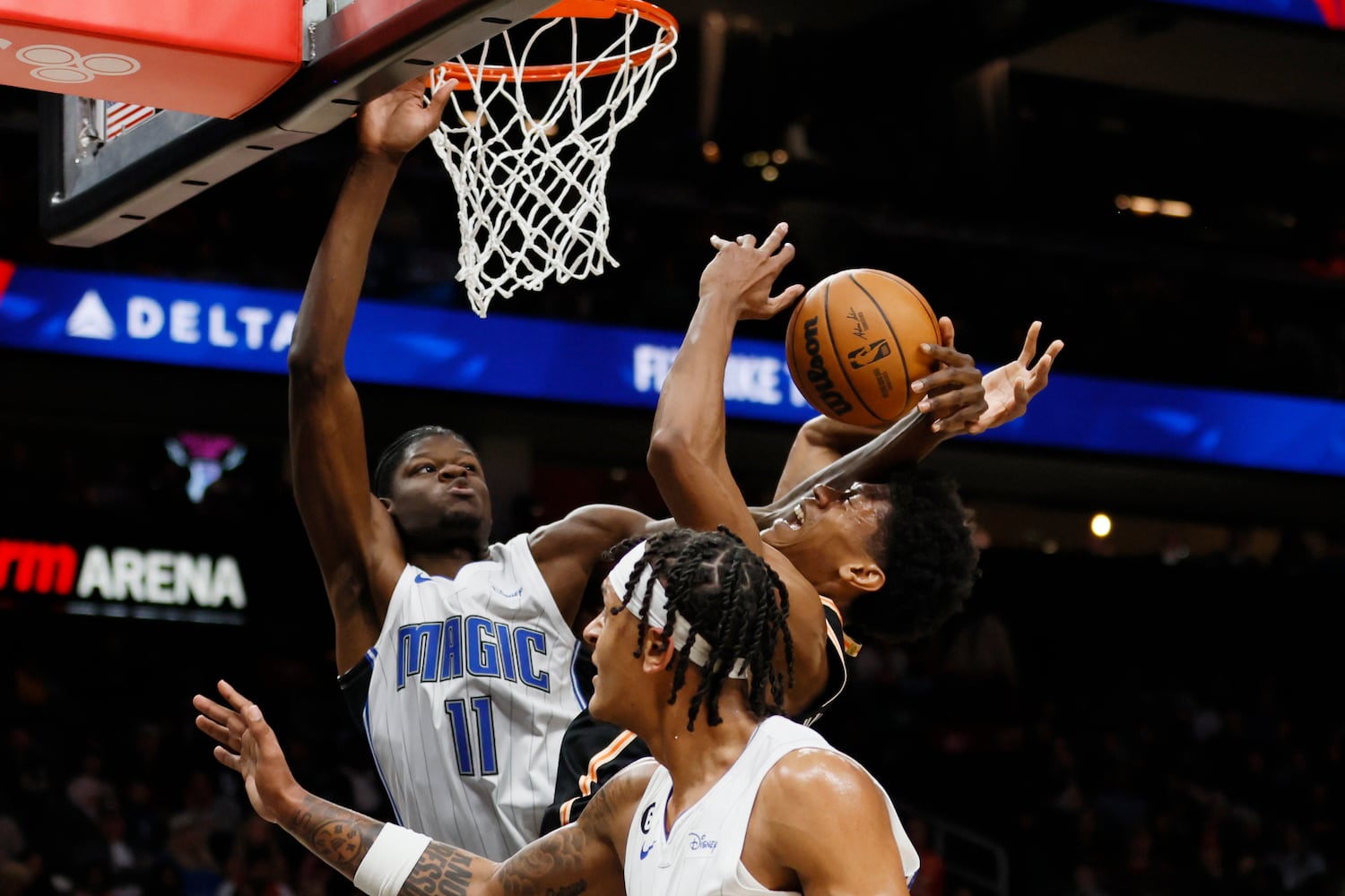 Hawks forward De'Andre Hunter gets fouled by Magic center Mo Bamba (11) as Hunter attempts a shot during the first half against the Magic on Monday night in Atlanta. (Miguel Martinez / miguel.martinezjimenez@ajc.com)