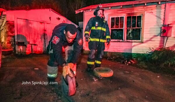 A man was pulled from a burning home Thursday morning in northwest Atlanta but later died at a hospital, officials said. 