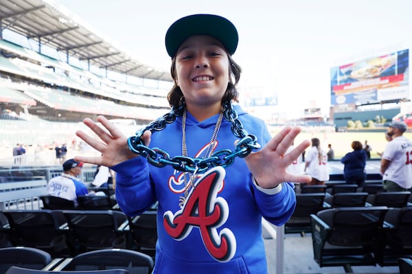 Cal Peña from Columbus, Ga, shows his big chain in support of the Atlanta Braves moments before Game 1 of the 2023 NLDS at Truist Park on Saturday, October 7, 2023, in Atlanta. 
Miguel Martinez / miguel.martinezjimenez@ajc.com 