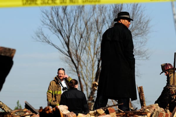 Atlanta police Lt. Keith Meadows, commander of the department's homicide unit, inspects the scene.