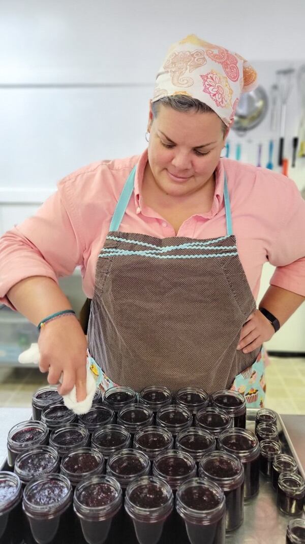 Lori Bean of Georgia Jams finishes a batch of spread featuring blueberries and wild honey. Courtesy of Michelle McMichael