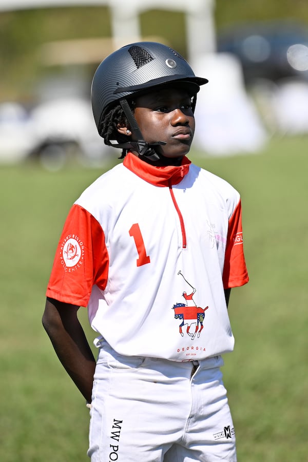 Caleb Choice Sanchez, a member of the B.E.S.T Academy Polo Team stands for the National Anthem before a match at the 7th Annual Atlanta Fashion and Polo Classic on Sunday, Oct. 13, 2024, in Fairburn, GA. (Jim Blackburn for the AJC)