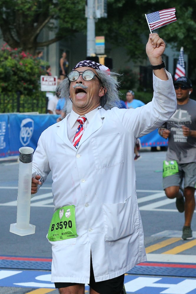 Runners show fashion flair during AJC Peachtree Road Race