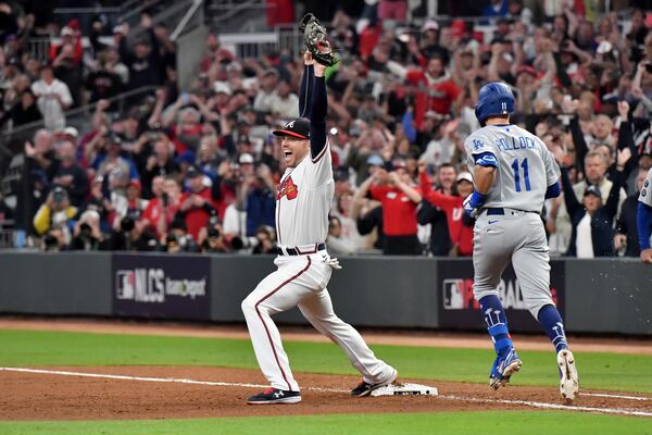 Braves first baseman Freddie Freeman celebrates after collecting the final out of Game 6 of the NLCS and advance to the World Series Saturday, Oct. 23, 2021, at Truist Park in Atlanta. (Hyosub Shin / Hyosub.Shin@ajc.com)