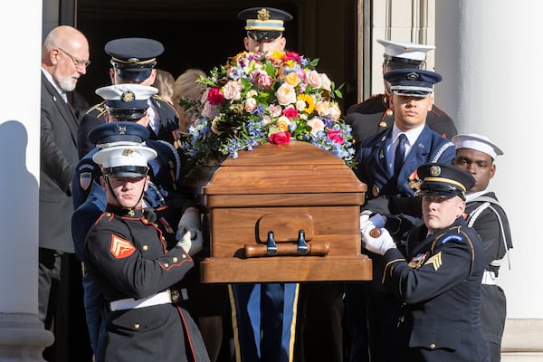 Rosalynn Carter's coffin is brought out of Glenn Memorial Church by the Armed Forces Body Bearers after the memorial service in Atlanta on Tuesday, Nov. 28, 2023.  (Steve Schaefer/AJC)