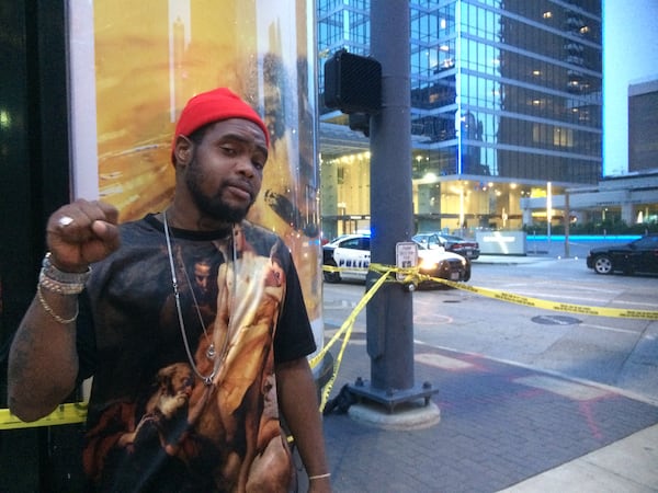 Keon Collins does not condone the sniper attacks but walked past police officers with his middle finger raised as a statement against police brutality in general. Photo: Jennifer Brett