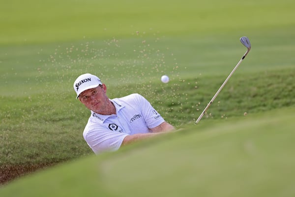 Sepp Straka hits out of the bunker on the eighteenth green during the second round of the Tour Championship at East Lake Golf Club, Friday, August 26, 2022, in Atlanta. (Jason Getz / Jason.Getz@ajc.com)