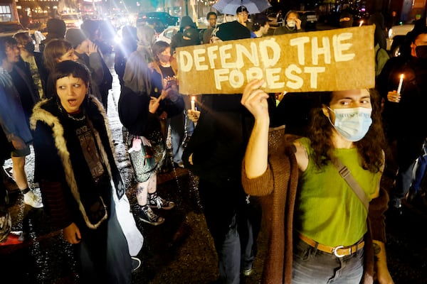 Demonstrators took the streets to protest in the heart of Little Five Points during a candlelight vigil responding to the killing of a forest protester who exchanged gunfire with a State Trooper Wednesday morning at Atlanta’s planned public safety training center. Miguel Martinez / miguel.martinezjimenez@ajc.com