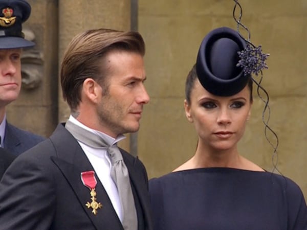 Why are these people smiling? Posh and Becks (aka former Spice Girl Victoria Beckham and her soccer star hubby David Beckham) made a big sartorial splash at the 2011 wedding of Prince William and Kate Middleton. Word is the couple -- and their unique look --are on the guest list again for the May 19 royal wedding of Prince Harry and Meghan Markle.