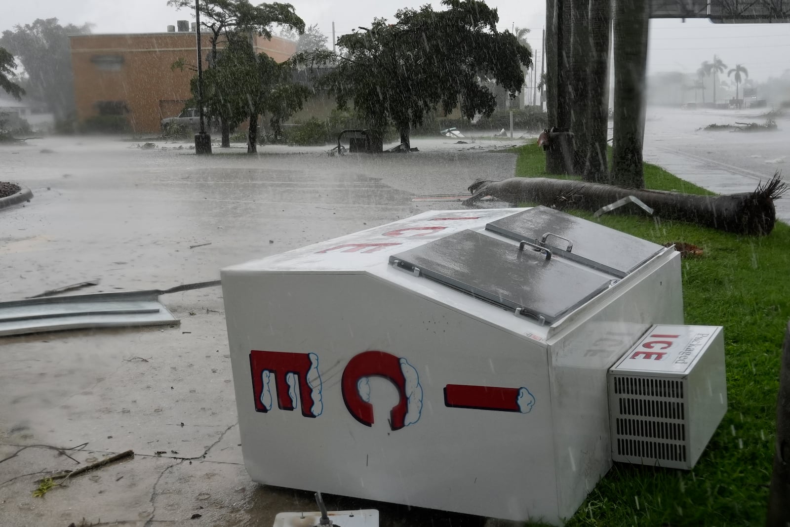 An apparent tornado caused by Hurricane Milton tossed an ice machine into the parking lot of a 7-Eleven convenient store, Wednesday, Oct. 9, 2024, in Cape Coral, Fla. (AP Photo/Marta Lavandier)