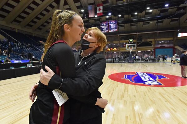 Hebron Christian's head coach Jan Azar (right) and Nicole Azar celebrate winning the Class A Private championship over St. Francis Wednesday, March 10, 2021, at the Macon Centreplex in Macon. Hebron Christian won 51-46 in overtime. (Hyosub Shin / Hyosub.Shin@ajc.com)