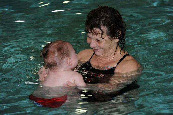 In this file photo, Nadyne Siegel Brown, owner of SwimKids of Georgia, based in Cumming, teaches aquatics survival and swimming lessons. A key component program is to learning how to roll on one’s back and float in water. CONTRIBUTED