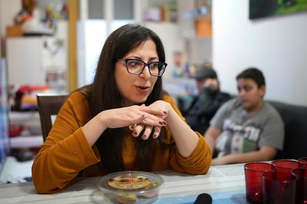 Nour Essa talks during an interview with the Associated Press in her house in Rome, Sunday, March 2, 2025. (AP Photo/Alessandra Tarantino)