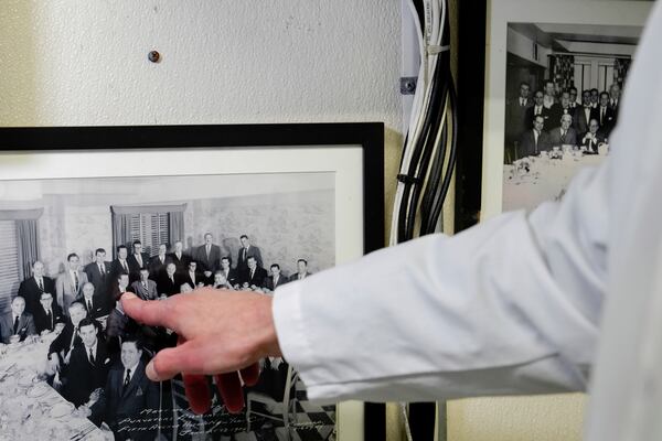 John Jobbagy shows his father in a photograph during an interview with The Associated Press at J.T. Jobbagy Inc. in the Meatpacking District of Manhattan, Tuesday, Nov. 19, 2024, in New York. (AP Photo/Julia Demaree Nikhinson)