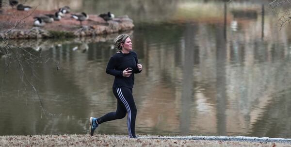 Lorna Triplett gets in 5 miles of running at Lake Avondale in Avondale Estates earlier this year. JOHN SPINK/JSPINK@AJC.COM