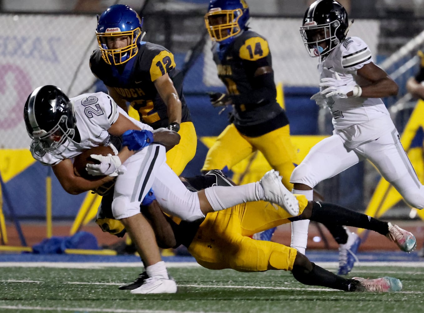 Alpharetta running back Jake Gil (26) runs for a first down in the second half against Chattahoochee at Chattahoochee high school Friday, September 25, 2020 in Johns Creek, Ga. Alpharetta won 21-7. JASON GETZ FOR THE ATLANTA JOURNAL-CONSTITUTION