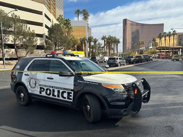 Police block the area after a vehicle caught fire and exploded outside the lobby of President-elect Donald Trump's hotel Wednesday, Jan. 1, 2025. (AP Photo/Ty ONeil)