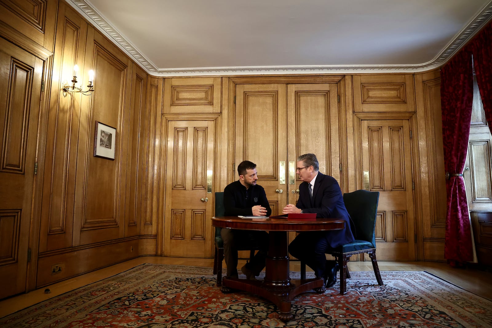 Britain's Prime Minister Keir Starmer, right, and Ukraine's President Volodymyr Zelenskyy speak during a bilateral meeting inside 10 Downing Street, in London, Thursday Oct. 10, 2024. (Henry Nicholls/Pool Photo via AP)