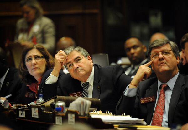 State House Rules Chair Richard Smith, center, died this past week after fighting the flu. He was one of the most influential members in the House as head of the panel that determines which bills get votes on the floor. HYOSUB SHIN / HSHIN@AJC.COM