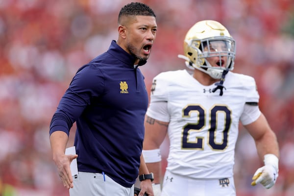 Notre Dame head coach Marcus Freeman reacts during the first half of an NCAA football game against Southern California, Saturday, Nov. 30, 2024, in Los Angeles. (AP Photo/Ryan Sun)