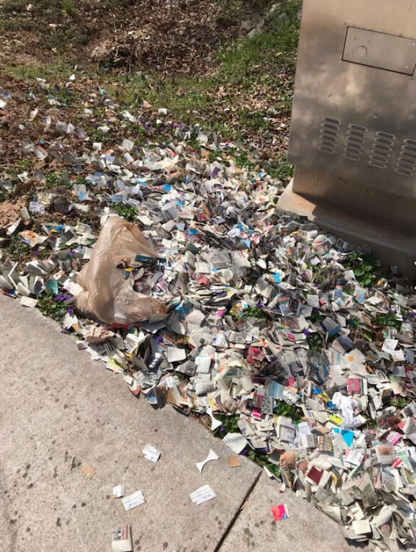 An unknown person has been chopping up inserts, stuffing them into plastic grocery bags and tossing them onto neighborhood streets and yards in the Mableton area. (Photo courtesy of Dan Colestock)